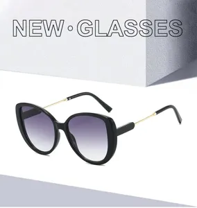 Detailansicht stilvoller Retro-Cat-Eye-Sonnenbrille mit Farbverlaufsgläsern und Kontrastrahmen.