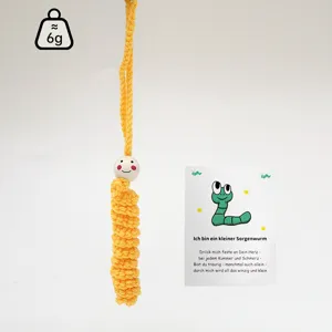 Handmade crochet yellow worry worm hanging charm with wooden bead head and cute card.