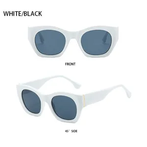 Schicke Retro-Katzenauge-Sonnenbrille mit dickem weißem Gestell und dunklen Gläsern.