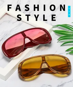 Detailed view of trendy oversized shield sunglasses with gradient lenses for men and women.