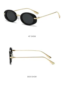 Detailansicht von Retro-Ovale Sonnenbrille mit schwarzen Fassungen und goldenen Metallbügeln.