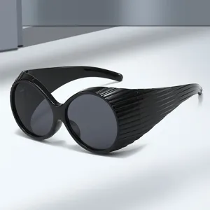 Vintage oversized round sunglasses with pleated side shields for women fashion street style.