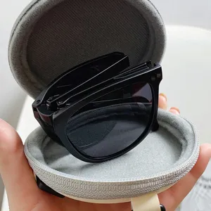 Stilvolle faltbare Sonnenbrille mit tragbarem rundem grauen Etui für Outdoor-Reisen.