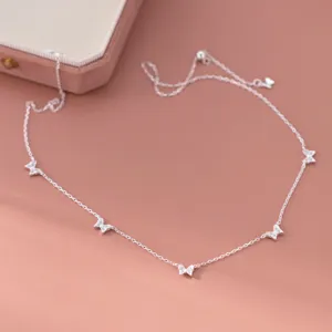 Exquisite S925 silver sparkling multi-butterfly necklace detail shot, elegant silver jewelry.