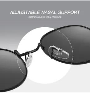 Détail de lunettes de soleil rondes rétro en métal avec plaquettes de nez en silicone.