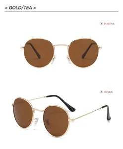 Lunettes de soleil rondes classiques en métal avec monture dorée et verres marron rétro style.