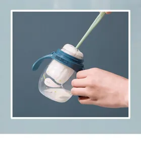 Baby bottle cleaning brush set with training sippy cup detail view for daily infant care.