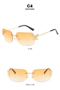 Rimless gradient orange sunglasses with chic butterfly rhinestone decor for women.