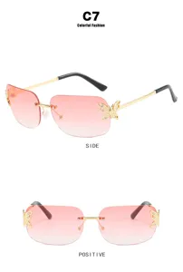Trendy rimless gradient pink sunglasses with chic butterfly rhinestones, perfect for women.