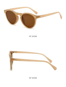 Vue détaillée de lunettes de soleil rondes vintage à monture beige et verres marron.