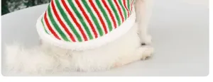 Cute Christmas pet costume detail showing soft red and green striped fabric with plush white trim.