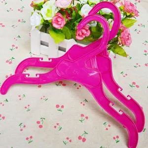 Pink plastic clothes hangers for small dogs and pets, cute mini coat hangers for puppy.
