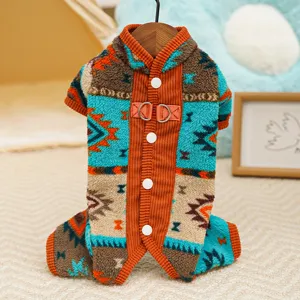 Close-up detail of winter fleece pet jumpsuit featuring ethnic geometric pattern and cozy orange trim.