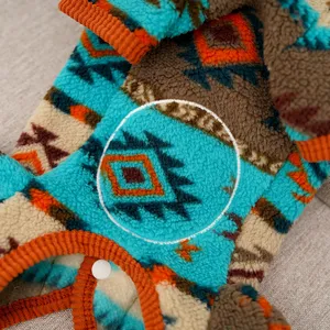 Cozy fleece pet dog cat four-leg jumpsuit detail showing ethnic geometric pattern and warm fabric.