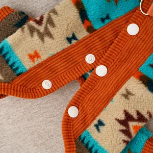 Pet fleece jumpsuit detail view, ethnic geometric pattern with cozy corduroy trim and snap buttons.