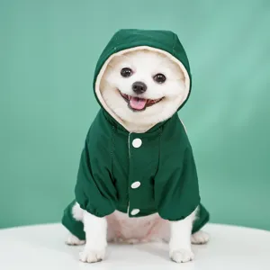 Green hooded pet raincoat jacket for dogs and cats, warm winter four-leg apparel for outdoor pets.