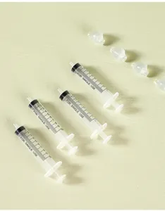 Detailed view of baby nasal aspirator syringe with soft silicone tips for safe cleaning.