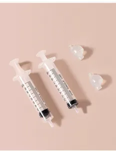 Baby nasal aspirator syringe set with silicone tips for infant nasal cleaning detail view.