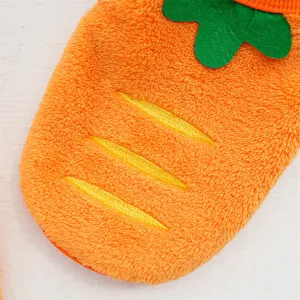 Close-up of cute carrot pet hoodie detail, soft orange fleece texture with green felt leaves.