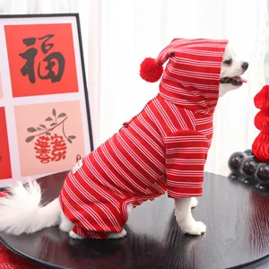 Detailed view of red white striped pet hoodie for small dogs, cozy fleece with pom-pom.