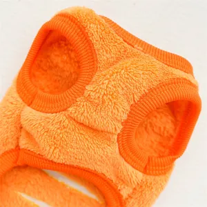 Orange fleece pet vest detail close-up, cozy winter warm clothing for small dogs and cats.