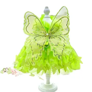 Green fairy pet dress for dogs and cats with large butterfly wings and sparkly lace details.