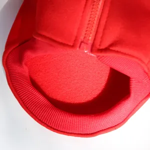 Red pet dog winter warm clothing detail shot showing soft fleece lining and zipper.