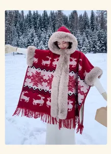 Detailed view of the winter Christmas reindeer knit hooded cape poncho with faux fur trim and fringes.