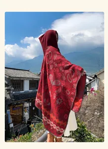 Detailed view of women's ethnic style hooded knit cloak shawl, perfect for autumn vacation outfits.