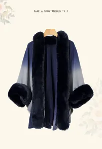 Detailed view of gradient knitted shawl cape with plush faux fur collar and cuffs.