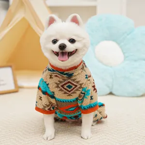 Detailed view of winter fleece pet pajamas with geometric Fair Isle pattern in cozy scene.
