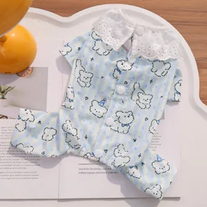 Detailed view of cute striped pet dog clothes with lace collar and adorable bear print, cozy.