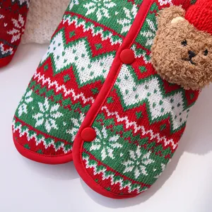 Christmas pet knitted vest detail, red green snowflake pattern with cute plush bear and buttons.