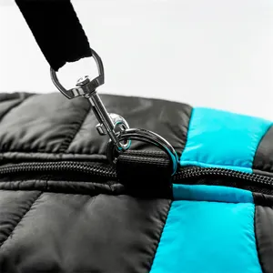 Close-up detail of warm dog winter puffer vest with metal d-ring and durable zipper.