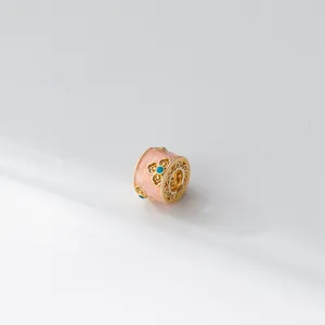 Detailed close-up shot of the exquisite 999 fine silver pink enamel lurutong charm pendant.
