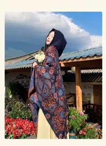 Ethnic style hooded knitted cloak shawl for women, perfect for autumn vacation outdoor wear.