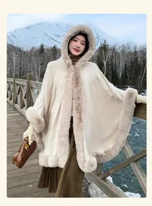 Faux fur hooded cape detail, cozy winter outdoor scene, elegant warm fashion apparel style.