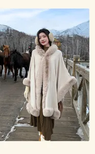 Detailed view of the elegant women's winter faux fur hooded cape shawl with warm fleece edging.
