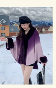 Gradient shawl cape coat featuring plush faux fur trim and elegant winter snowy outdoor style.