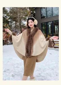Winter gradient faux cashmere cape detail with plush fur collar and cuffs in snowy outdoor scene.