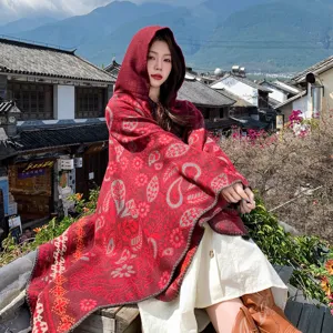 Ethnic hooded knitted cloak shawl for women, stylish bohemian winter warm poncho outerwear.
