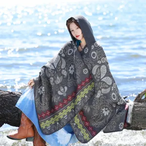 Ethnic style knitted hooded shawl for women, perfect for autumn winter wear and vacation photos.