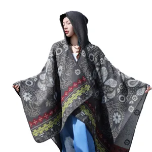 Ethnic hooded knitted cape for women, vintage floral tassel shawl, cozy autumn outerwear.