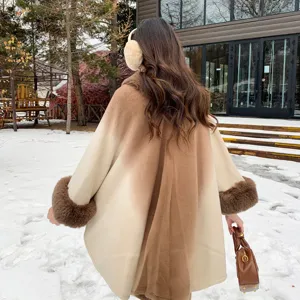 Winter gradient faux cashmere cape coat for women, elegant warm knitted cloak with plush cuffs.