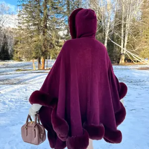 Women winter long hooded cape with plush fur trim warm outerwear elegant stylish cloak coat.