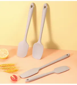 Silicone spatula set detail view, heat resistant kitchen baking tool scene texture.