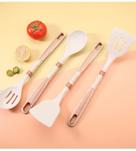 Silicone kitchen utensil set with marble handle, detail view of cooking spatulas and spoons.