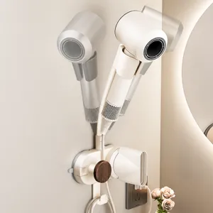 Wall-mounted hairdryer holder with adjustable angle and practical storage design for bathroom.