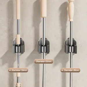 Wall-mounted mop and broom holder clip, punch-free adhesive organizer for bathroom home use.