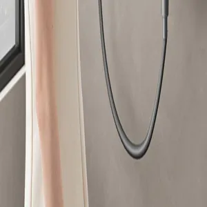 Bathroom shower hose detail shot, premium dark grey finish, durable fixture accessory.